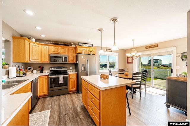 1291 Eagle View Dr, Buffalo, WY 82834 - kitchen with stainless steel appliances, a sink, a chandelier, light countertops, and recessed lighting