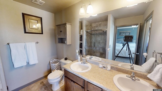 810 S 3rd Ave, Mills, WY 82604 - full bathroom with a tile shower, double vanity, toilet, tile patterned flooring, and baseboards