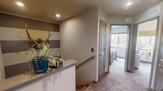 810 S 3rd Ave, Mills, WY 82604 - corridor featuring carpet flooring, an upstairs landing, and recessed lighting