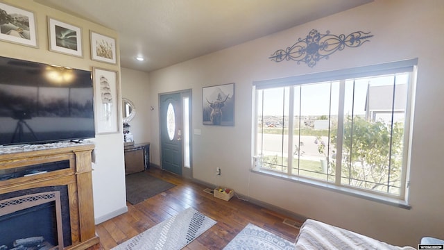 810 S 3rd Ave, Mills, WY 82604 - foyer with hardwood / wood-style flooring, baseboards, a fireplace, and recessed lighting