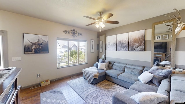 810 S 3rd Ave, Mills, WY 82604 - living room with wood-type flooring, a ceiling fan, and baseboards