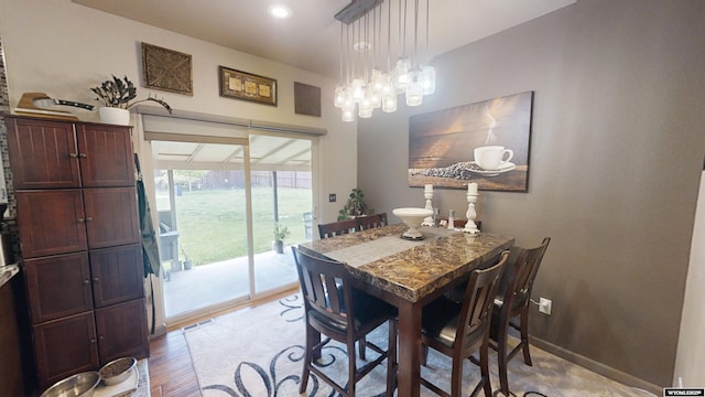 810 S 3rd Ave, Mills, WY 82604 - dining room featuring light wood-style floors and a chandelier