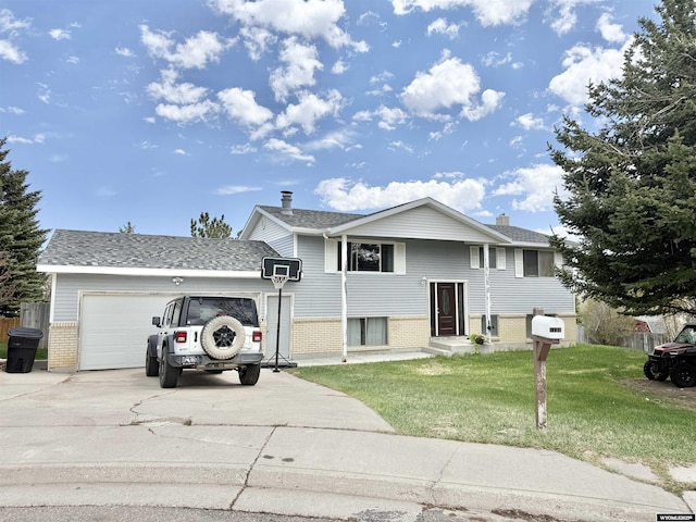 1130 Canyon Rd, Kemmerer, WY 83101 - view of front of house featuring brick siding, a garage, a front lawn, concrete driveway, and a chimney
