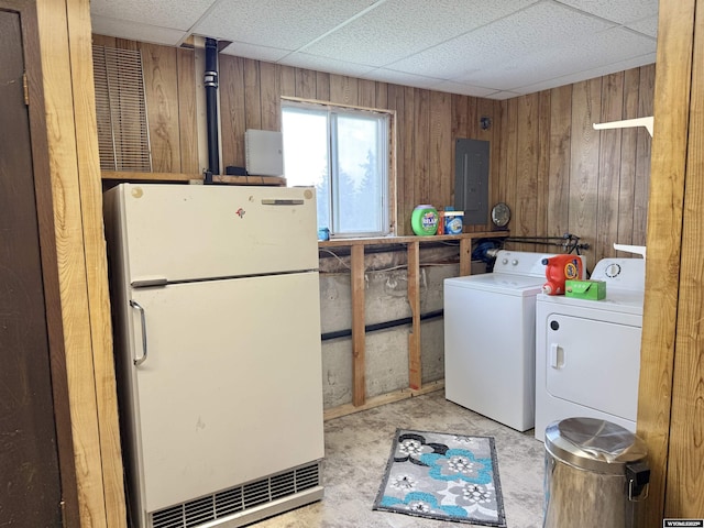 1130 Canyon Rd, Kemmerer, WY 83101 - laundry area featuring hookup for a washing machine, electric panel, and wooden walls