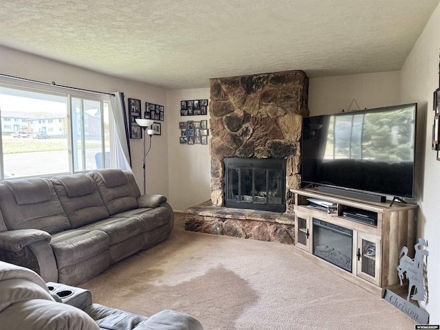 1130 Canyon Rd, Kemmerer, WY 83101 - carpeted living room featuring a stone fireplace and a textured ceiling
