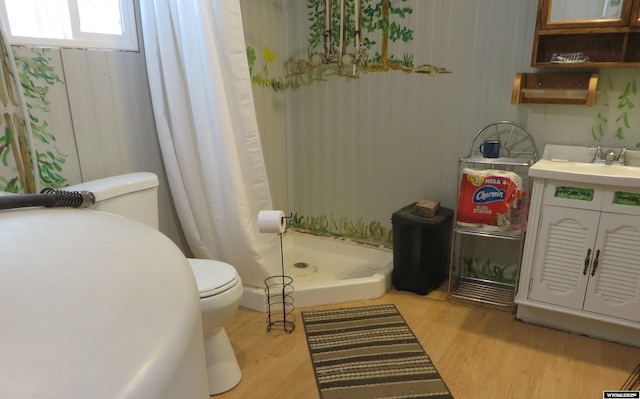 1725 E End Rd, Casper, WY 82601 - bathroom featuring toilet, a shower with shower curtain, vanity, and wood finished floors