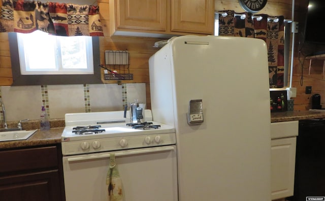 1725 E End Rd, Casper, WY 82601 - kitchen with white appliances, backsplash, and a sink