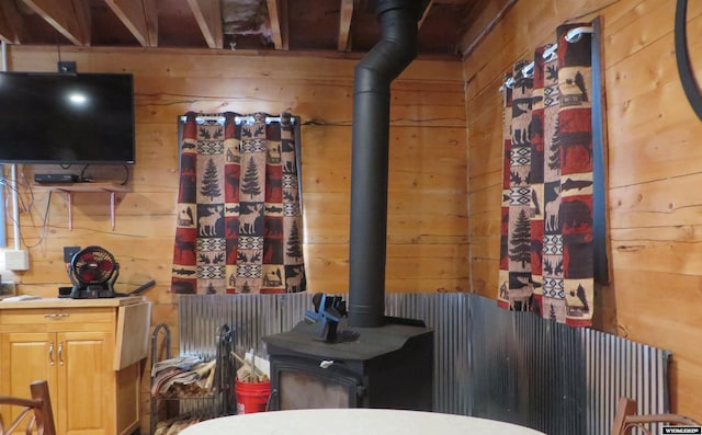 1725 E End Rd, Casper, WY 82601 - bathroom with wood walls, a wood stove, and toilet