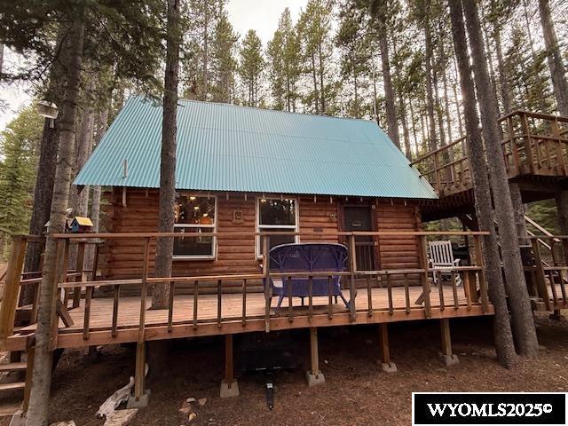 1725 E End Rd, Casper, WY 82601 - rear view of house with a wooden deck and metal roof