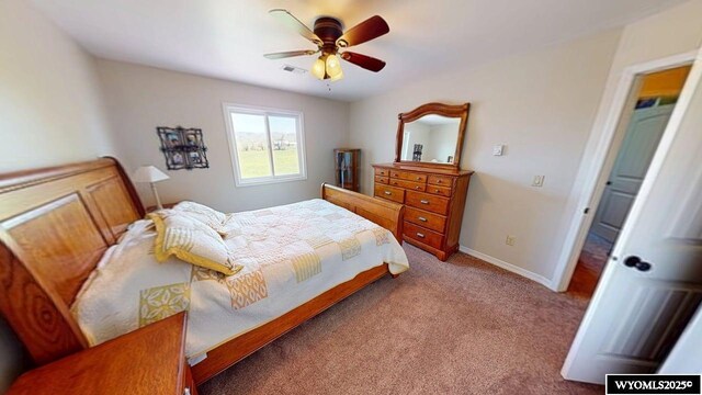 200 Irwin Ln, Lander, WY 82520 - carpeted bedroom with baseboards and a ceiling fan
