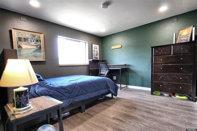 6653 Natrona Rd, Natrona, WY 82646 - bedroom with wood finished floors, recessed lighting, and baseboards