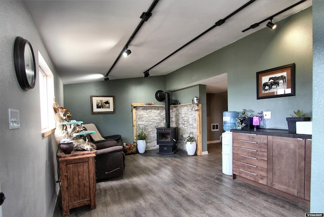 6653 Natrona Rd, Natrona, WY 82646 - living area featuring track lighting, a wood stove, and wood finished floors