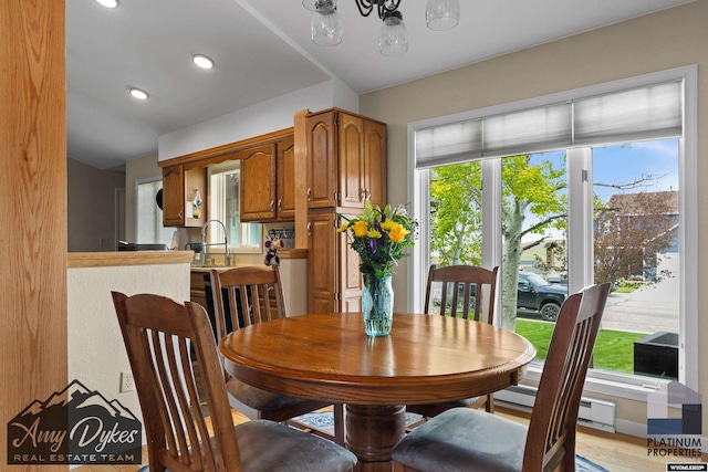 1131 W 60th St, Casper, WY 82601 - dining space featuring a chandelier, recessed lighting, and light wood finished floors