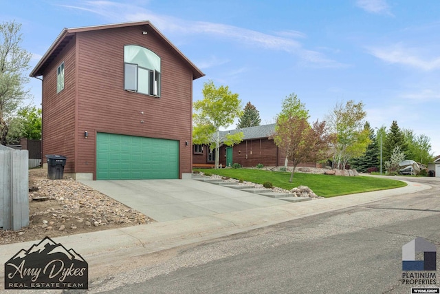 1131 W 60th St, Casper, WY 82601 - view of front of house featuring a garage, a front lawn, and concrete driveway