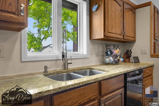 1131 W 60th St, Casper, WY 82601 - kitchen featuring wine cooler, brown cabinets, a textured wall, and light stone counters