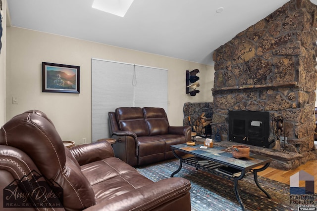 1131 W 60th St, Casper, WY 82601 - living area with wood finished floors, lofted ceiling, and a skylight