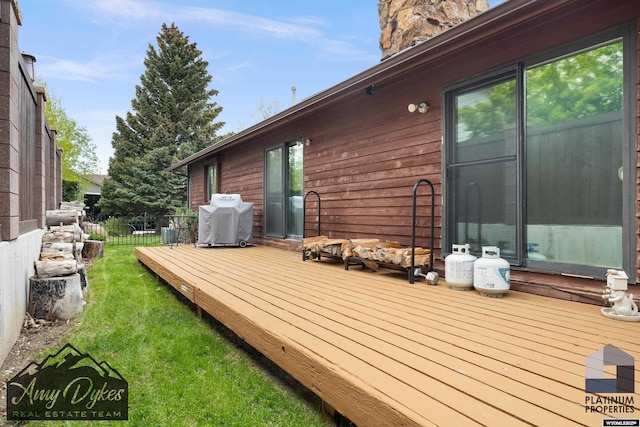 1131 W 60th St, Casper, WY 82601 - deck with area for grilling and a yard