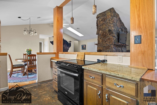 1131 W 60th St, Casper, WY 82601 - kitchen with black range with electric cooktop, lofted ceiling, a skylight, light stone countertops, and pendant lighting