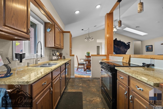 1131 W 60th St, Casper, WY 82601 - kitchen with black electric range, a sink, vaulted ceiling, a skylight, and a ceiling fan