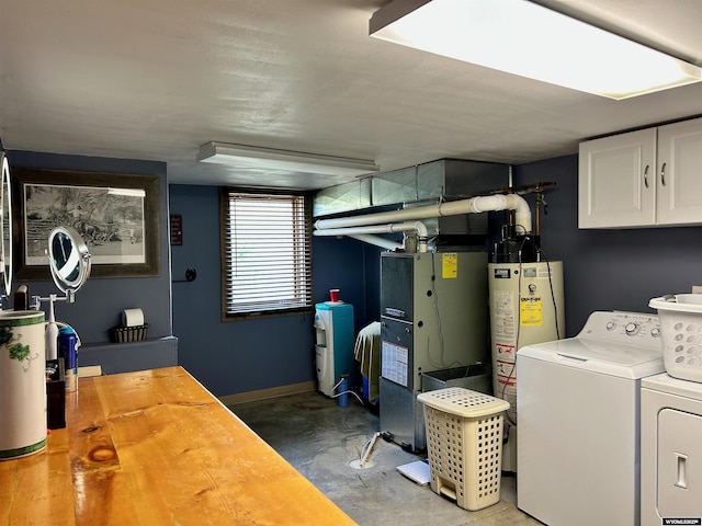 2609 Beaver Creek Rd, Shell, WY 82441 - washroom with washing machine and dryer, gas water heater, cabinet space, baseboards, and heating unit