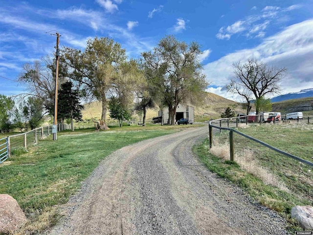 2609 Beaver Creek Rd, Shell, WY 82441 - view of dirt / gravel driveway featuring a view of rural / pastoral area and a mountain view