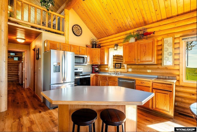 49 Cheyenne Rd, Banner, WY 82832 - kitchen featuring stainless steel appliances, log walls, high vaulted ceiling, wood ceiling, and a sink