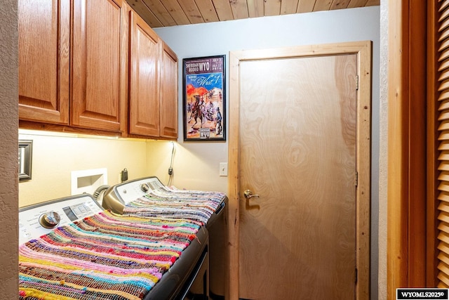 49 Cheyenne Rd, Banner, WY 82832 - laundry area featuring cabinet space and washing machine and clothes dryer