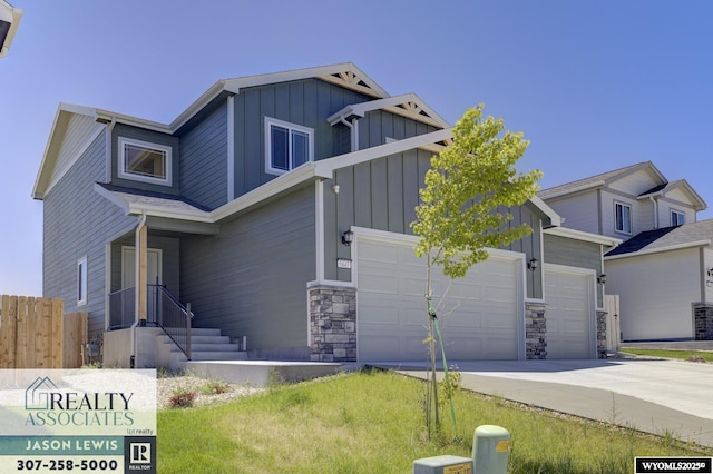 5845 Overlook Way, Mills, WY 82604 - view of front of house featuring board and batten siding, concrete driveway, and a garage