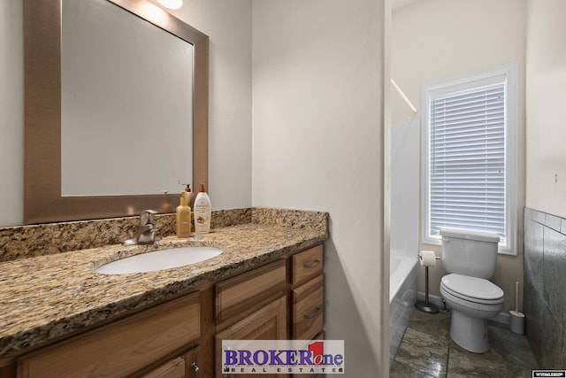 2511 Mercy Ln, Casper, WY 82609 - full bath with vanity, toilet, and shower / bathtub combination