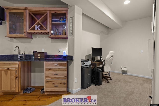 2511 Mercy Ln, Casper, WY 82609 - home office with bar with sink, baseboards, and light carpet