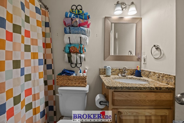 2511 Mercy Ln, Casper, WY 82609 - full bathroom featuring vanity, toilet, and a shower with shower curtain