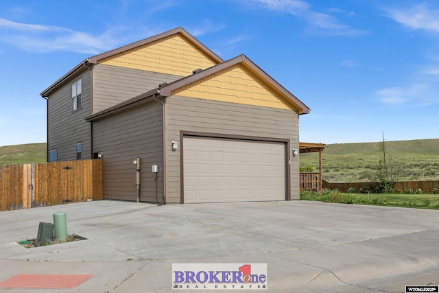 2511 Mercy Ln, Casper, WY 82609 - view of home's exterior with concrete driveway and an attached garage