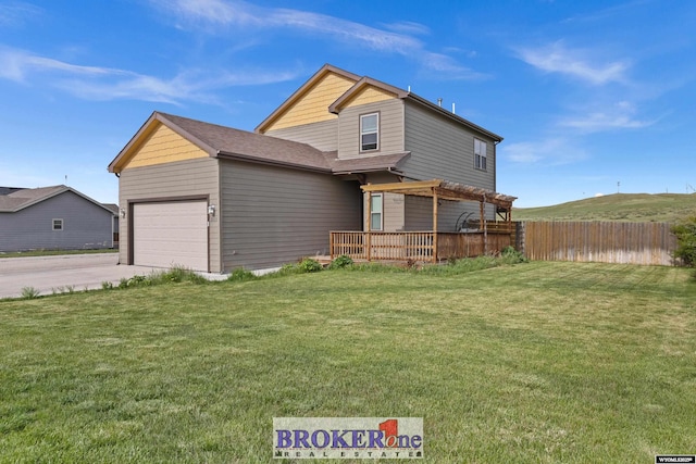 2511 Mercy Ln, Casper, WY 82609 - traditional-style house featuring a garage, concrete driveway, and a wooden deck