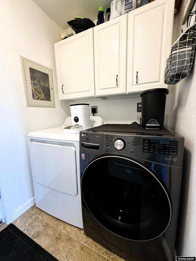 1216 Charles Ave, Worland, WY 82401 - washroom featuring cabinet space, washing machine and clothes dryer, and baseboards
