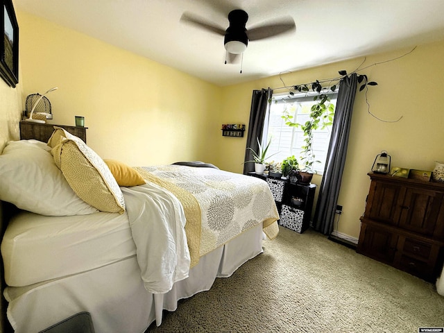 1216 Charles Ave, Worland, WY 82401 - bedroom with light colored carpet and a ceiling fan