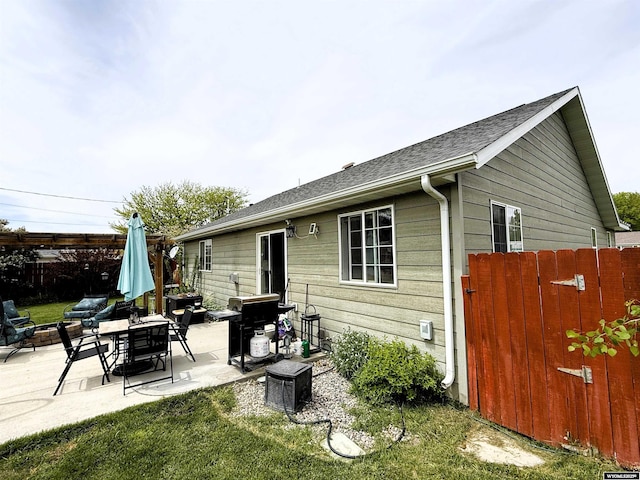 1216 Charles Ave, Worland, WY 82401 - back of house featuring a patio area
