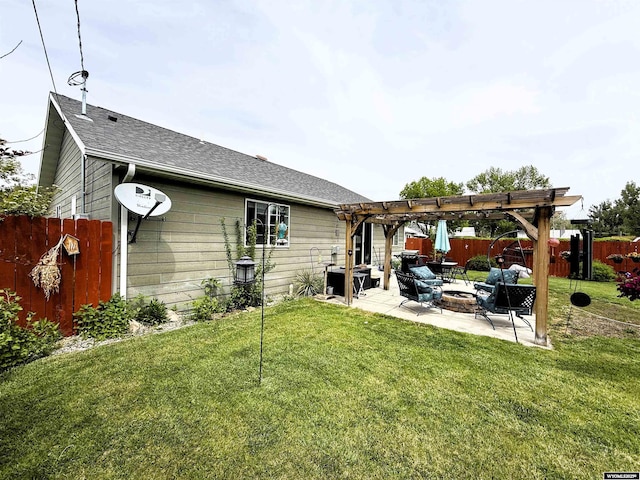 1216 Charles Ave, Worland, WY 82401 - back of property featuring a patio, a pergola, a fire pit, and roof with shingles