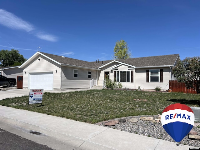 1426 Pinecrest, Riverton, WY 82501 - single story home featuring an attached garage, driveway, and a shingled roof