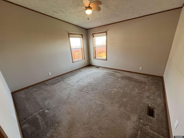 1426 Pinecrest, Riverton, WY 82501 - empty room with crown molding, baseboards, carpet floors, a textured ceiling, and ceiling fan