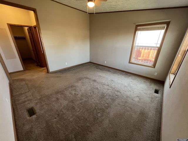 1426 Pinecrest, Riverton, WY 82501 - empty room featuring carpet floors, a ceiling fan, baseboards, crown molding, and a textured ceiling