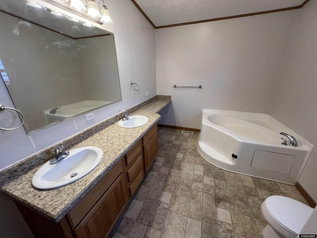 1426 Pinecrest, Riverton, WY 82501 - bathroom with a bath, ornamental molding, double vanity, baseboards, and stone finish floors
