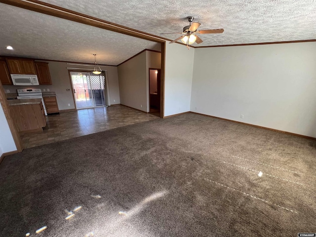 1426 Pinecrest, Riverton, WY 82501 - unfurnished living room featuring a textured ceiling, ornamental molding, baseboards, dark colored carpet, and ceiling fan