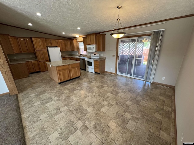 1426 Pinecrest, Riverton, WY 82501 - kitchen with white appliances, a sink, a textured ceiling, baseboards, and light stone finish floors