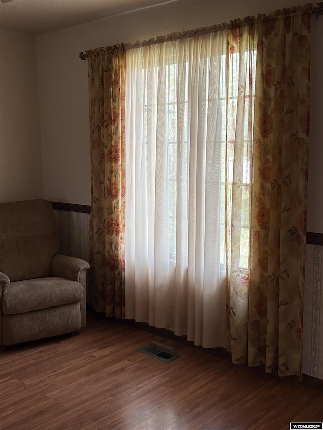 221 Rimrock Dr, Evanston, WY 82930 - sitting room with healthy amount of natural light and wood finished floors