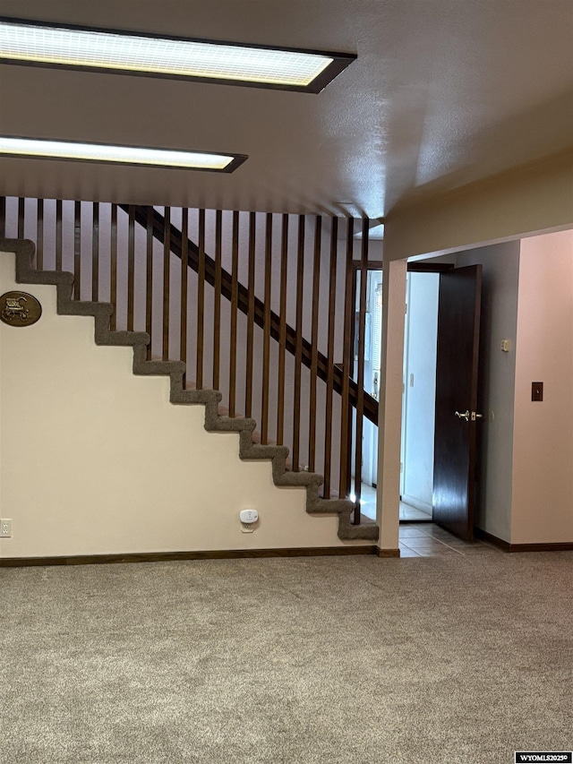 221 Rimrock Dr, Evanston, WY 82930 - staircase with carpet floors and baseboards