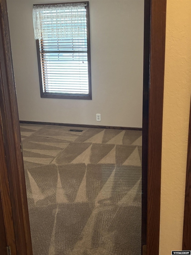 221 Rimrock Dr, Evanston, WY 82930 - carpeted spare room with baseboards