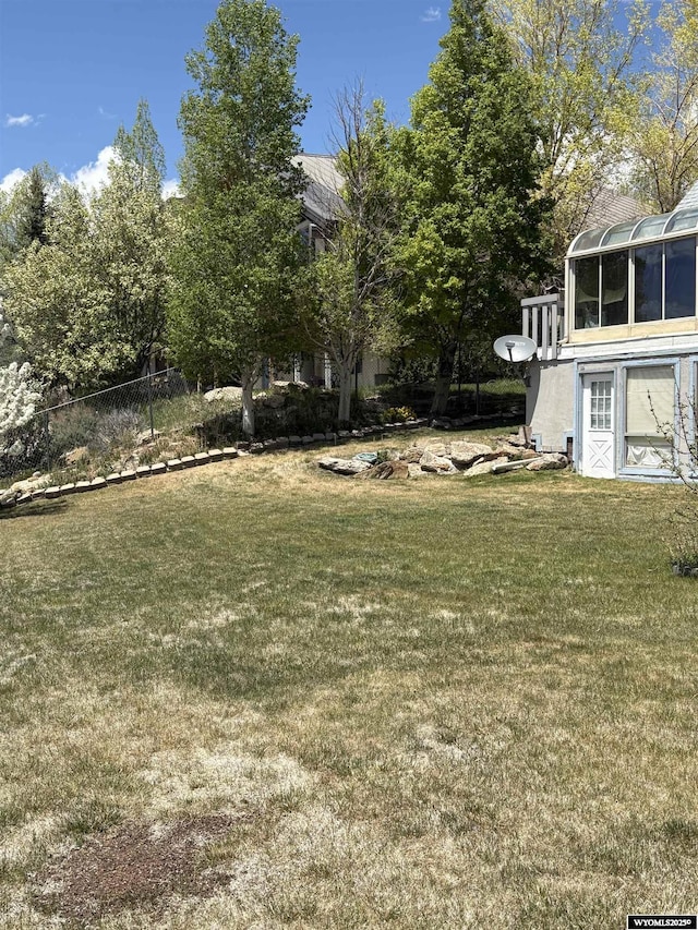 221 Rimrock Dr, Evanston, WY 82930 - view of yard with a sunroom