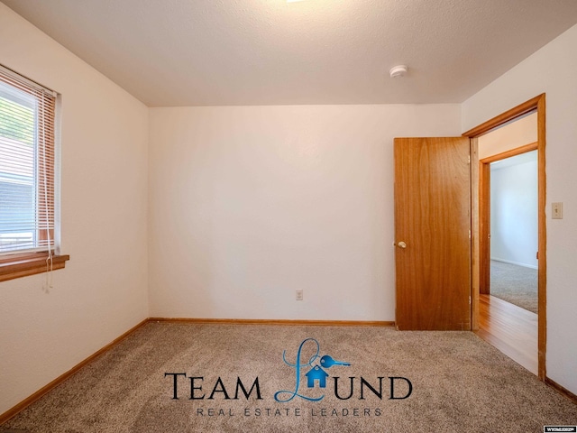 1235 S Durbin St, Casper, WY 82601 - empty room with carpet floors, a smoke detector, and baseboards