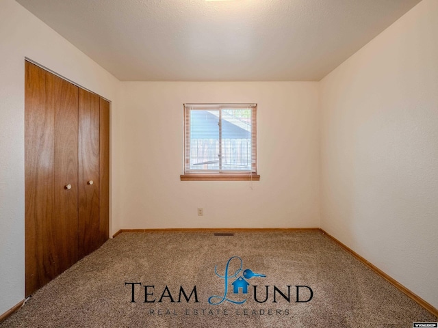 1235 S Durbin St, Casper, WY 82601 - unfurnished bedroom featuring carpet floors, baseboards, and a closet