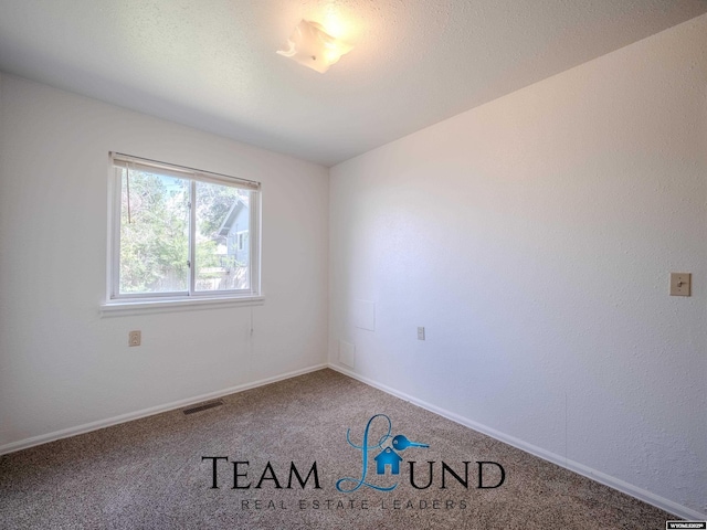 1235 S Durbin St, Casper, WY 82601 - spare room featuring carpet flooring and baseboards